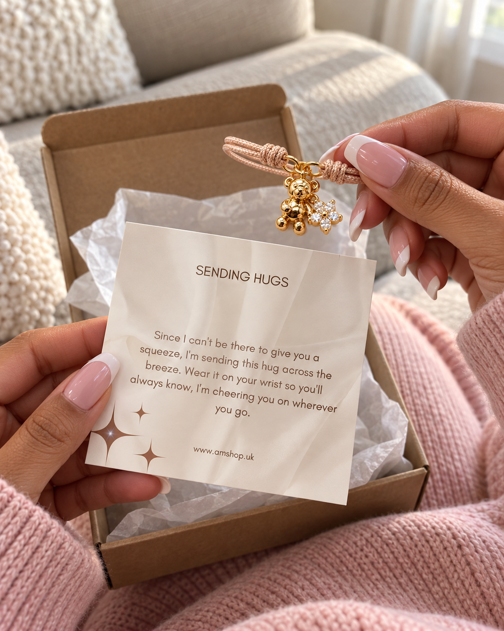Recipient holding a teddy bear bracelet and Sending Hugs message card while opening a gift at home