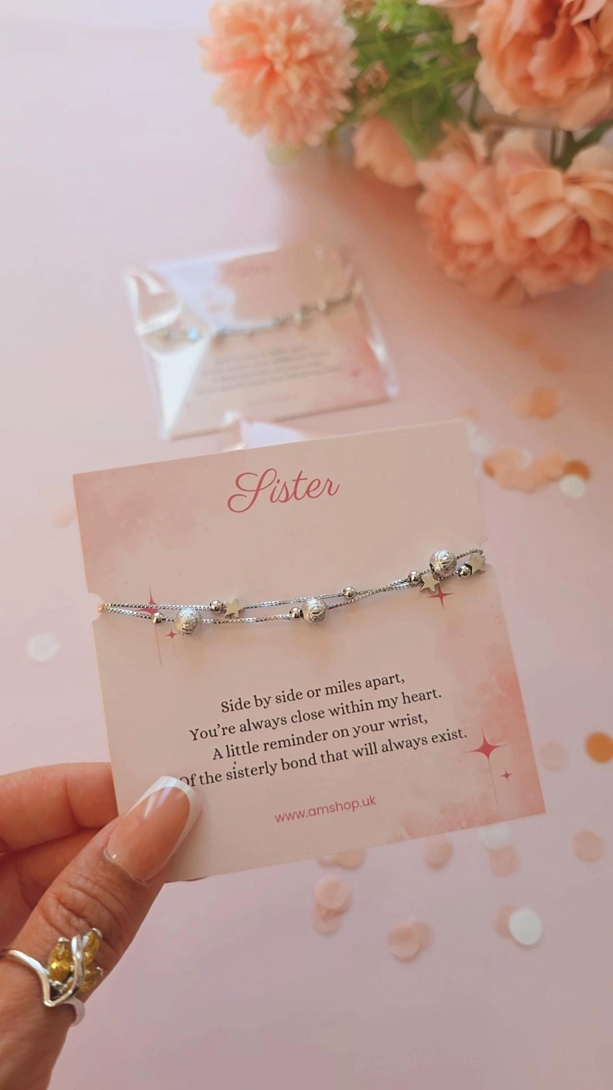 Sister bracelet sentiment card held by hand